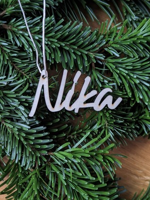 //www.woelkchen.nrw/Shop/Weihnachten/artikel_Geschenkanhaenger-Holz-Schriftzug-Name_193.html